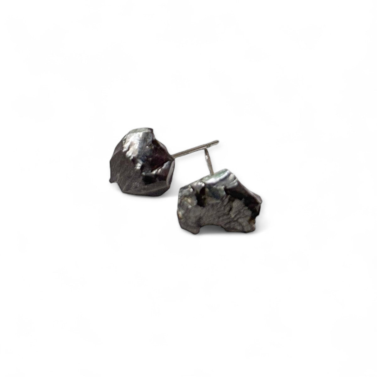 Raw noble shungite stud earrings with stainless steel posts, front view on white background