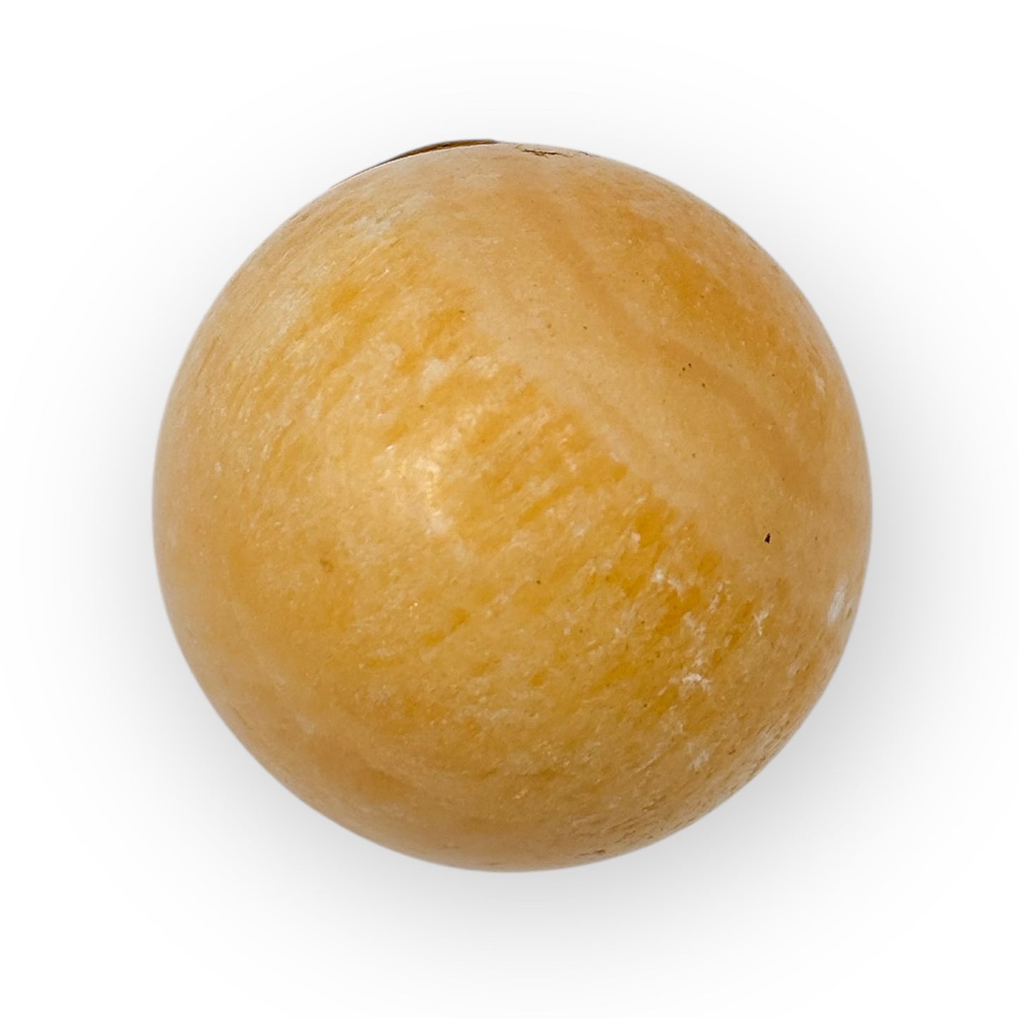 Close-up of Orange Calcite egg featuring soft polish, vibrant color, and creative energy