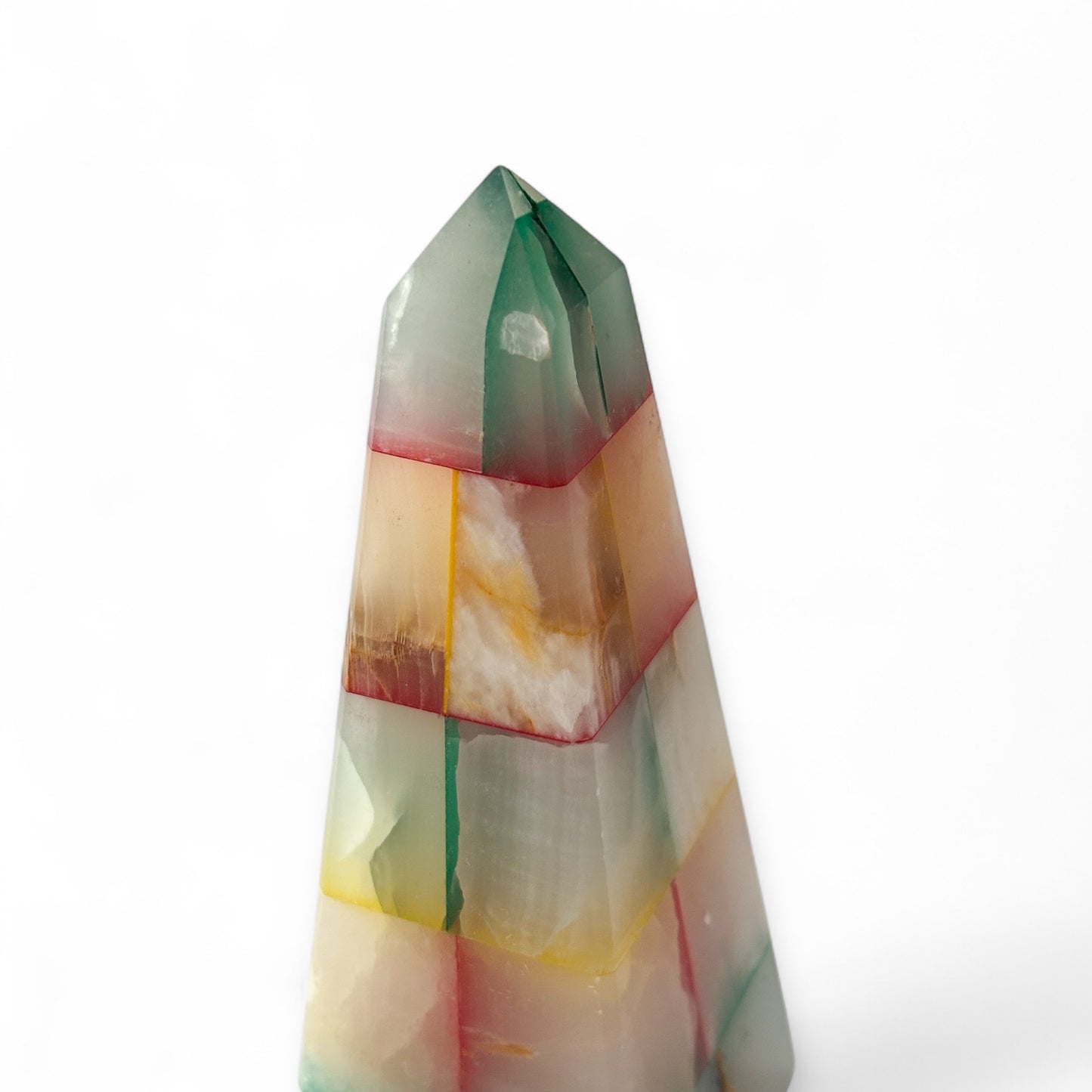 Polished patchwork onyx crystal with vibrant natural tones
