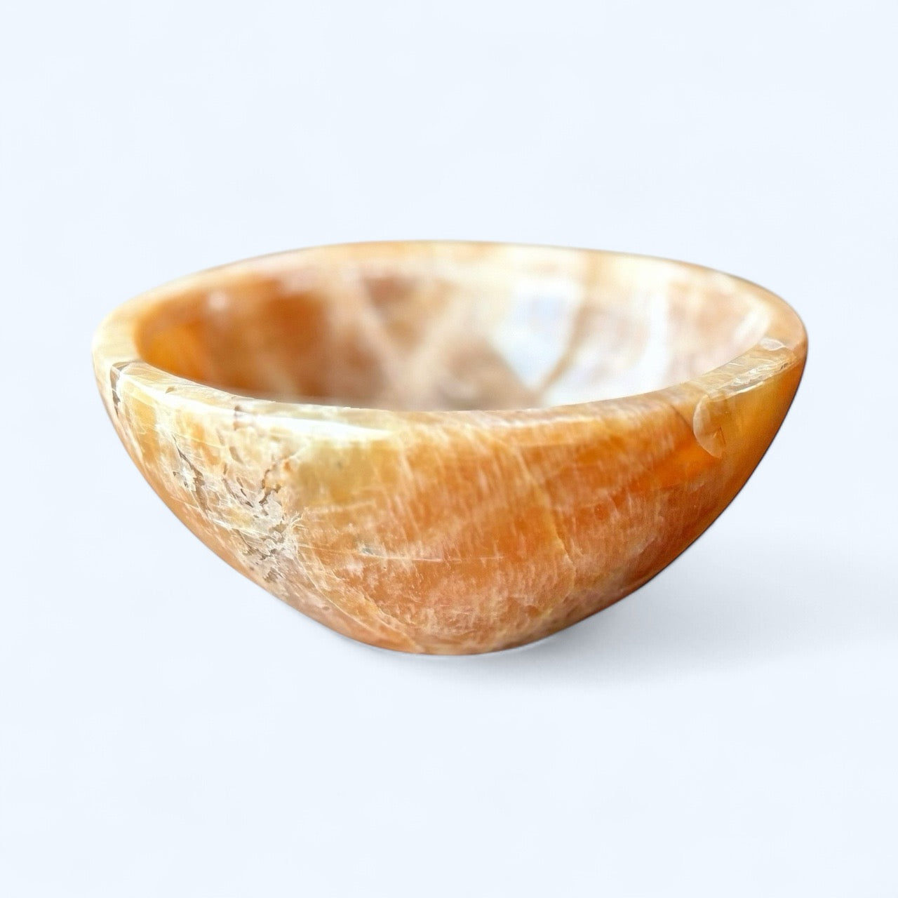 Hand-carved Peach Moonstone bowl with soft peach and cream tones – front view