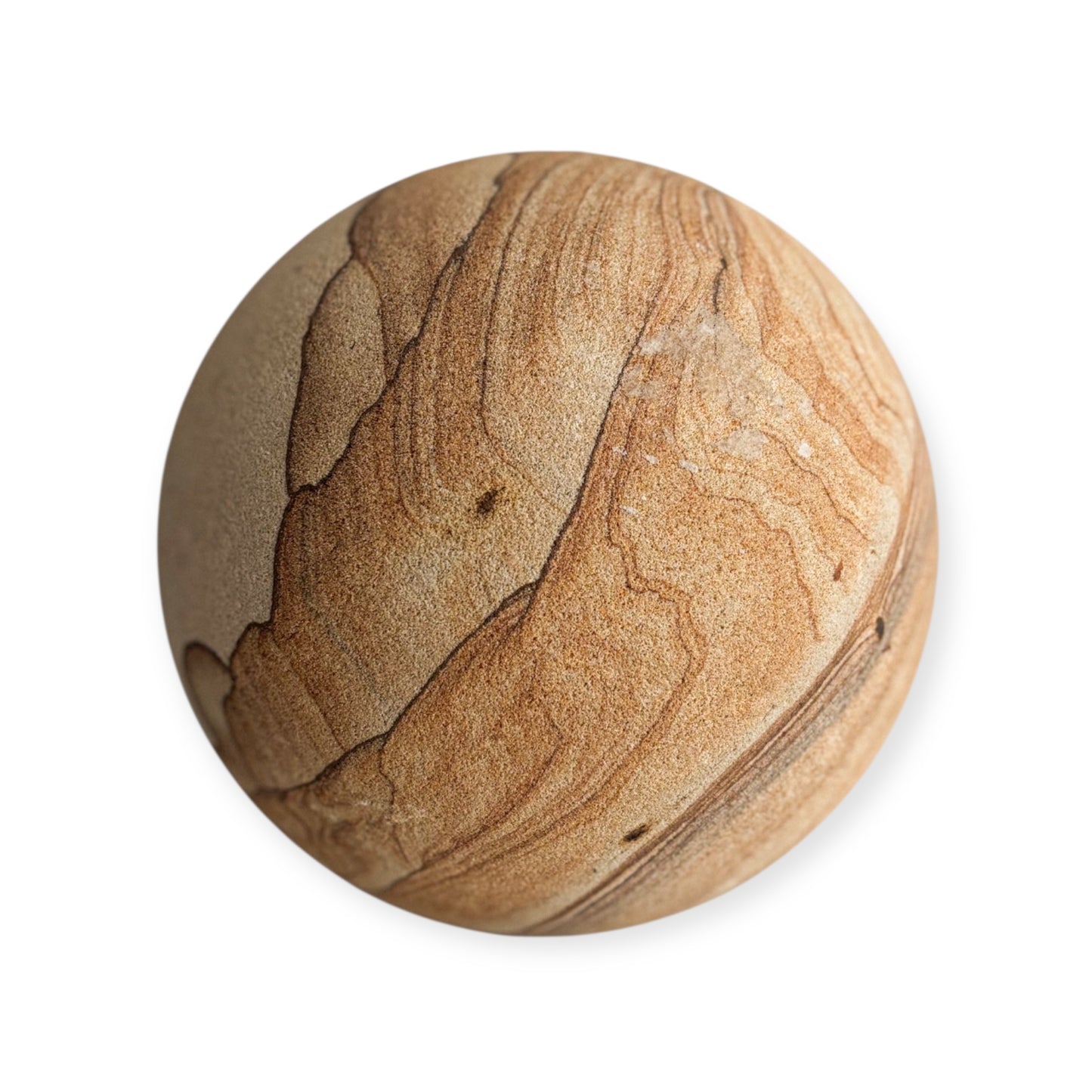 Picture Sandstone Sphere showing circular natural swirls in tan and rust