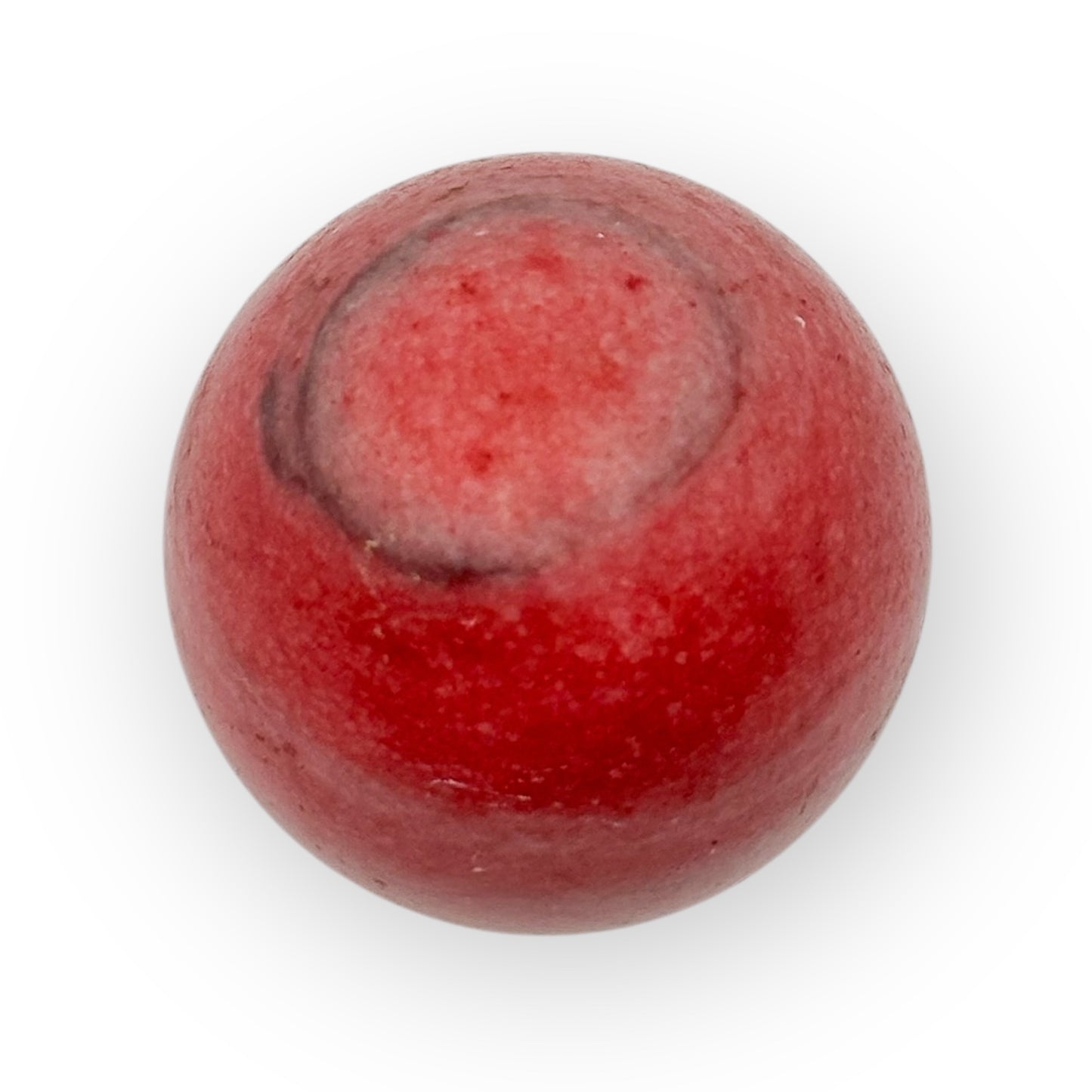 Close-up of Pink Agate egg with striking pink coloration and grounding crystal texture