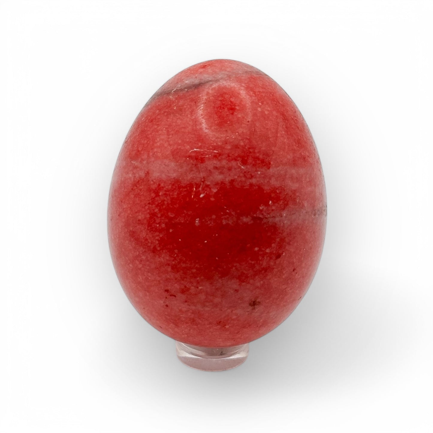 Pink Agate egg on display stand featuring rich pink tones and polished surface