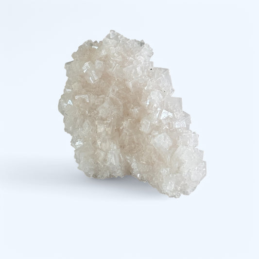 Natural Pink Halite Mineral with Soft Pink Hues on Display