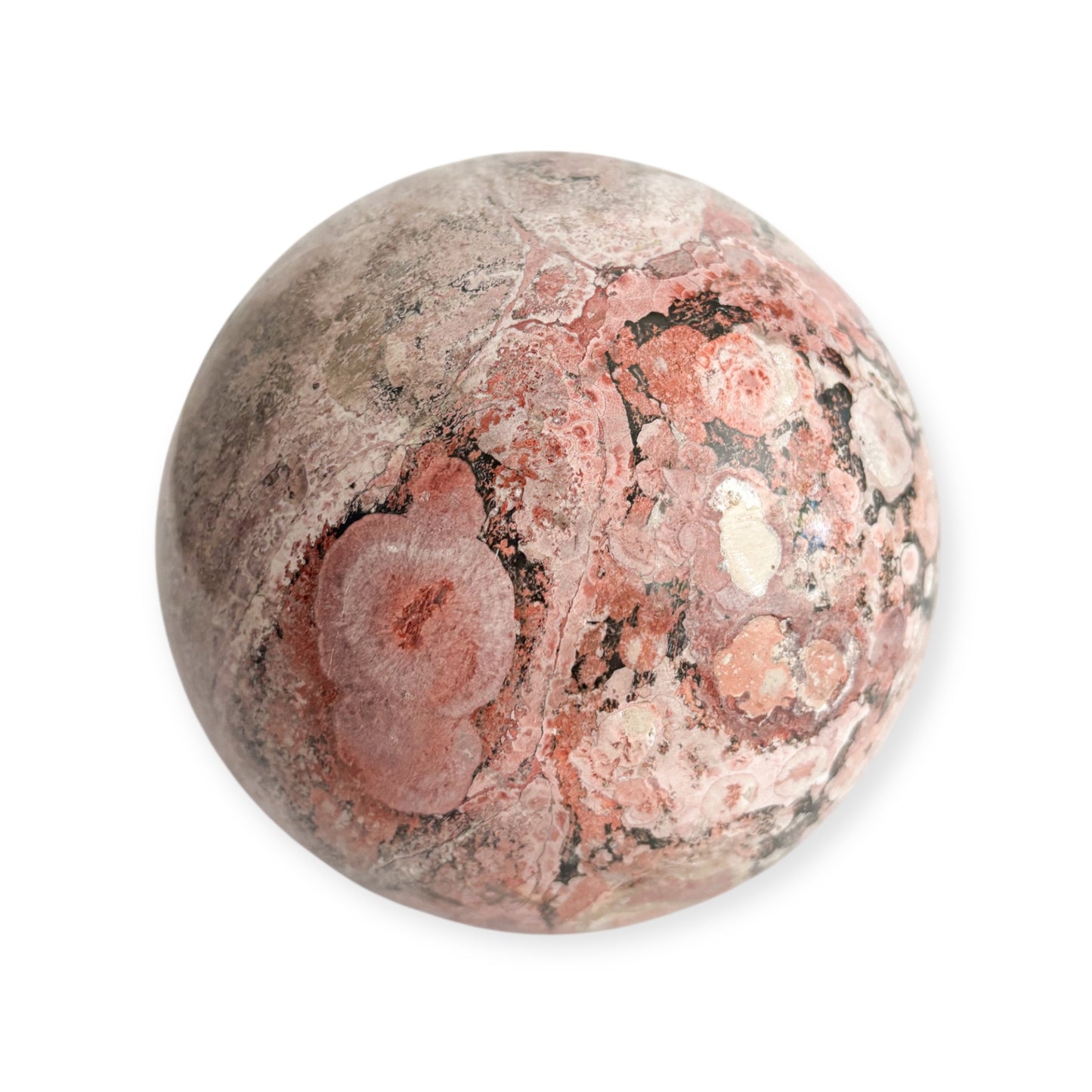 Pink Rhodonite sphere with natural swirls and black veining