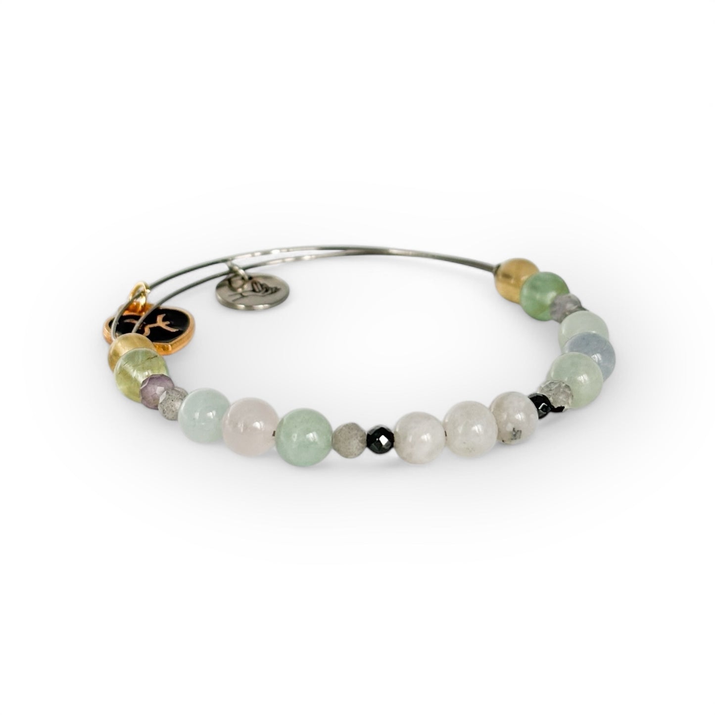 Close-up of Pisces Crystal Charm Bracelet with a black charm, highlighting its soft, mystical gemstone colors.