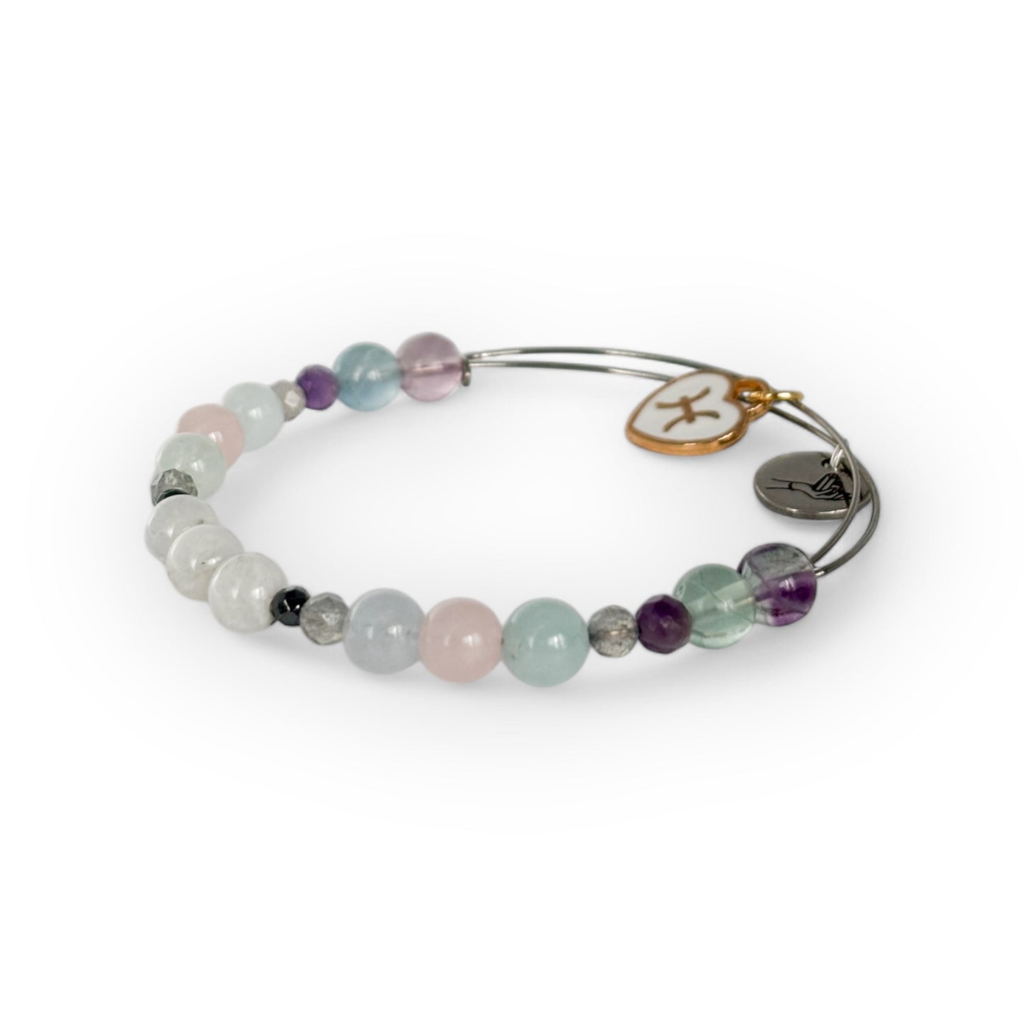 Close-up of Pisces Crystal Charm Bracelet with a white charm, showcasing its soft blue, purple, and pink gemstone beads.