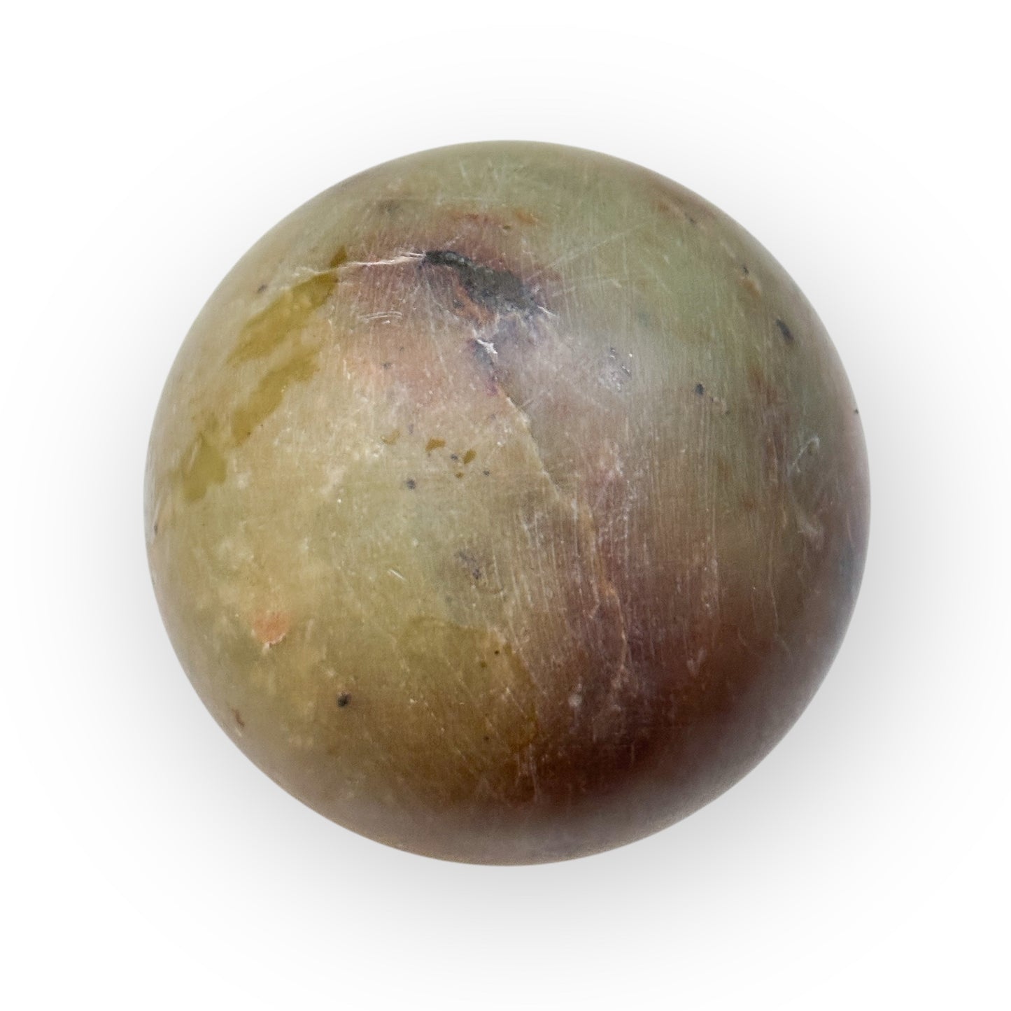 Closeup of the texture and colors of a matte Polychrome Jasper Sphere