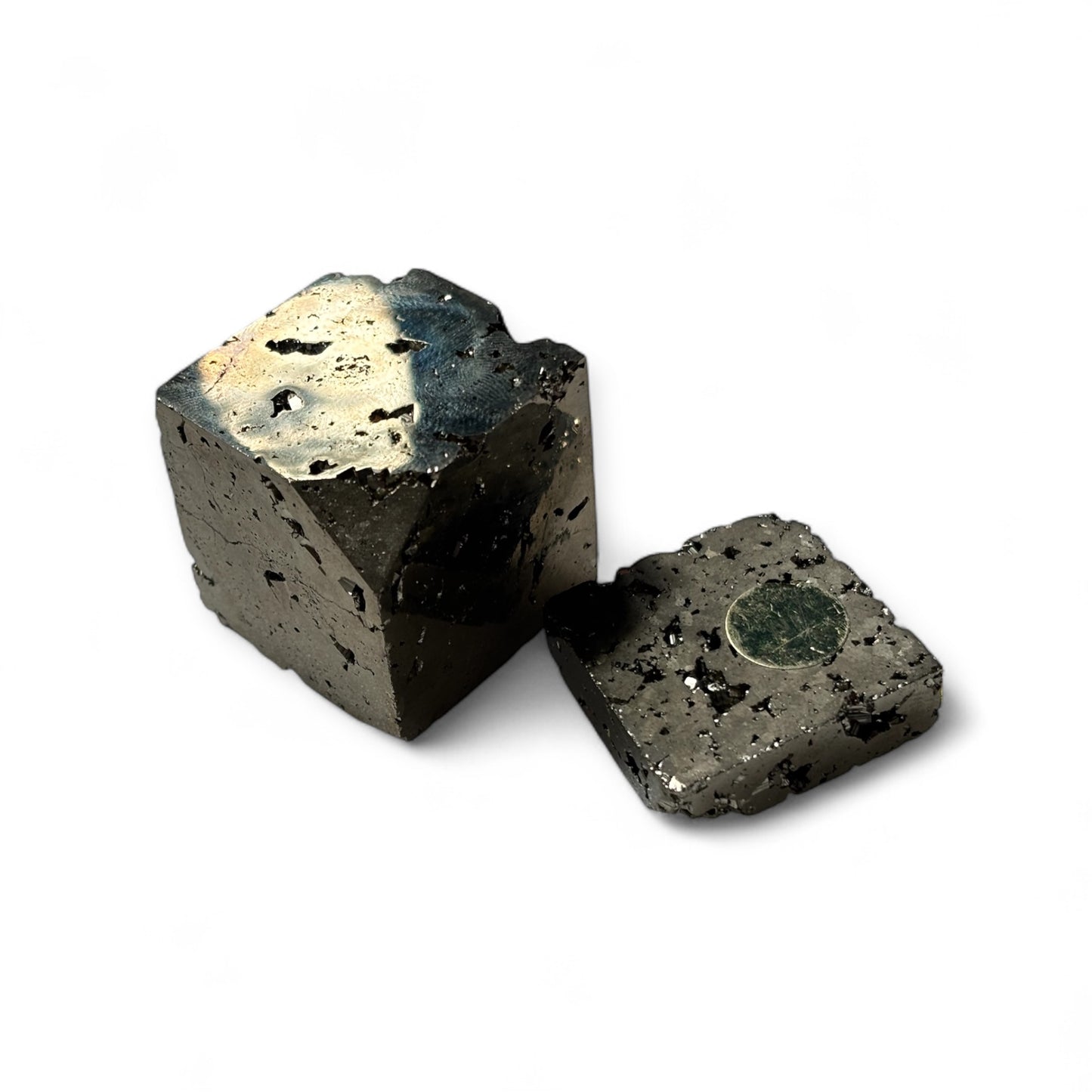 Pyrite cube displayed on shelf – grounding decor for workspace