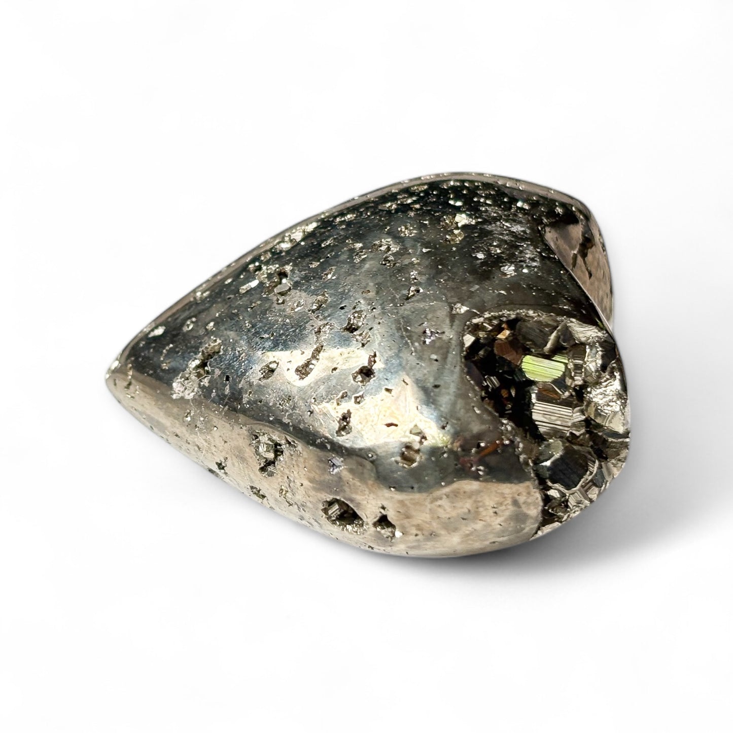 Side angle of Pyrite heart showing metallic luster and raw edges