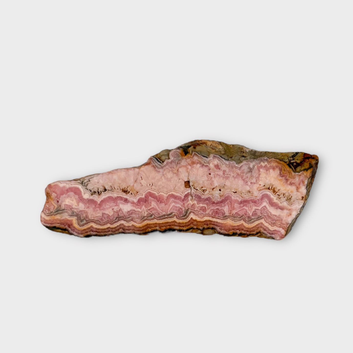 Flat lay of Rhodochrosite slab for crystal healing and heart chakra work