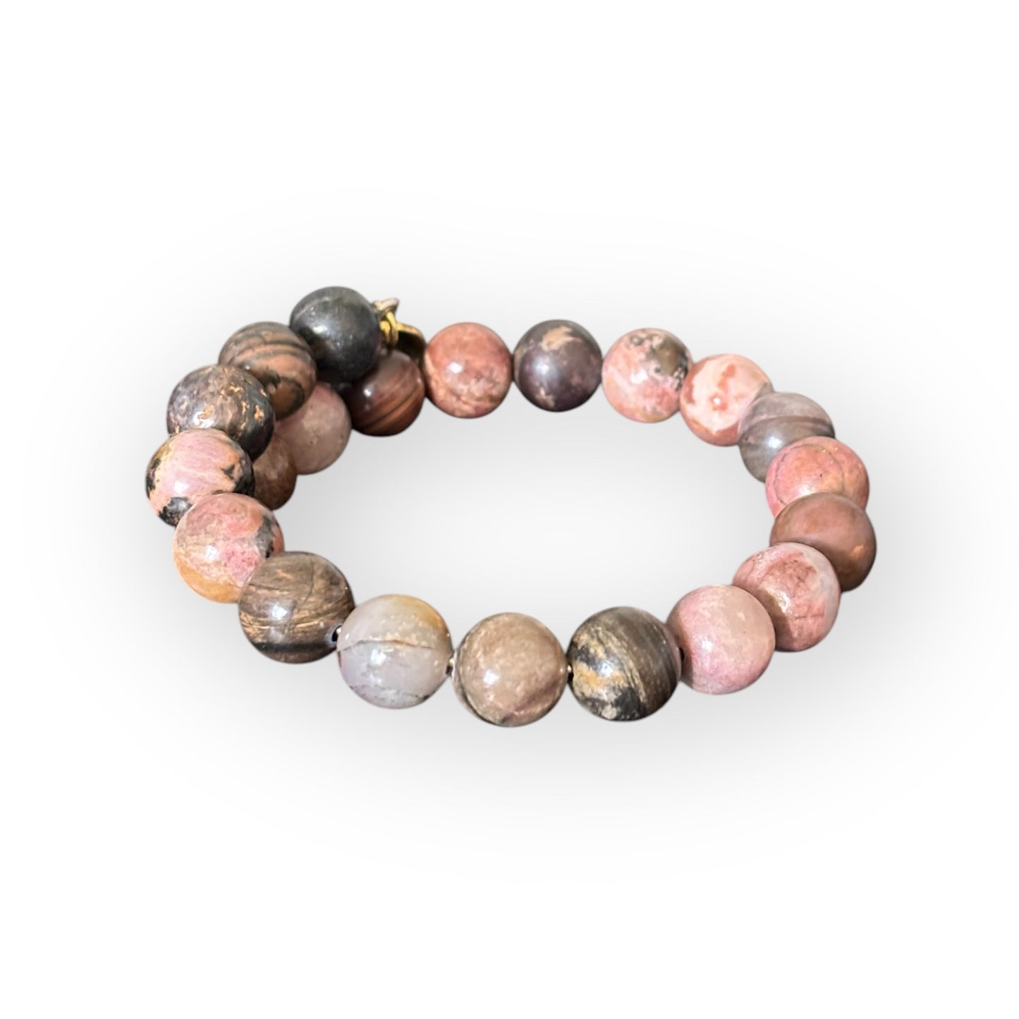 Close-up of Rhodonite crystal bracelet, known for promoting self-love and emotional healing.