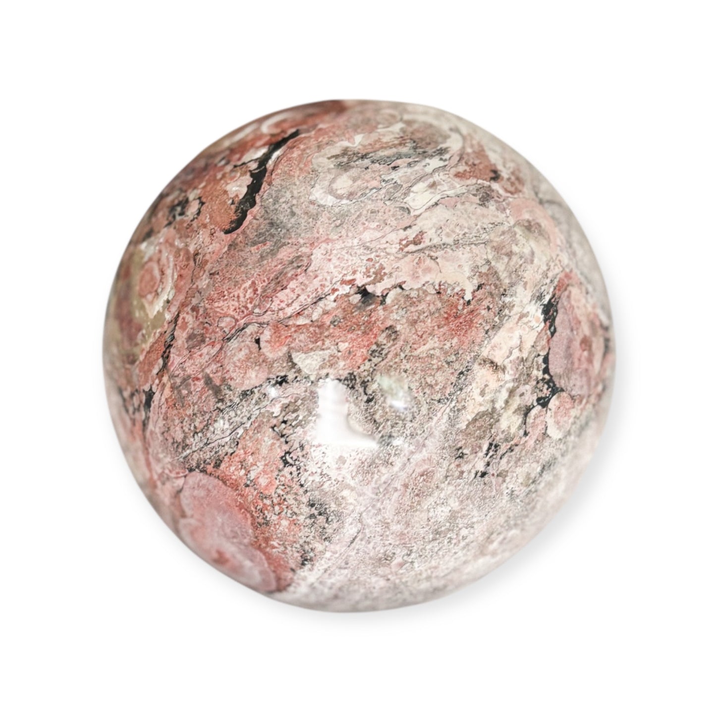 Close-up of polished Rhodonite sphere with bold color contrast