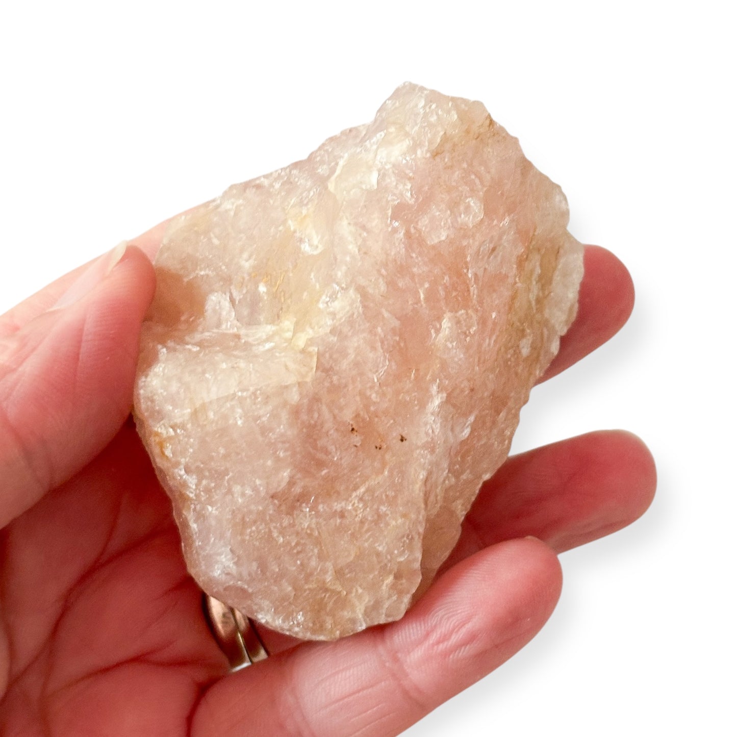 Hand holding medium rough Rose Quartz