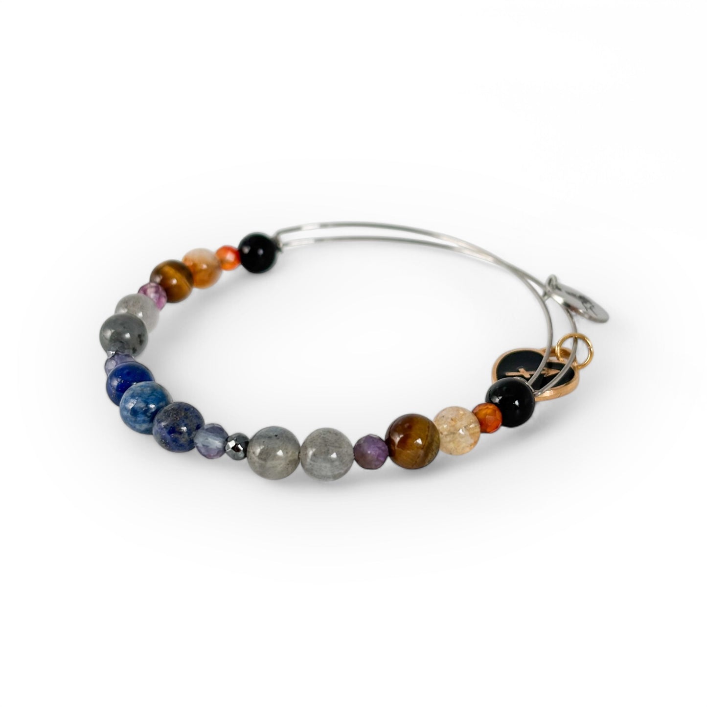 Close-up of Sagittarius Crystal Charm Bracelet with a black charm, highlighting its deep, earthy gemstones and bold design.