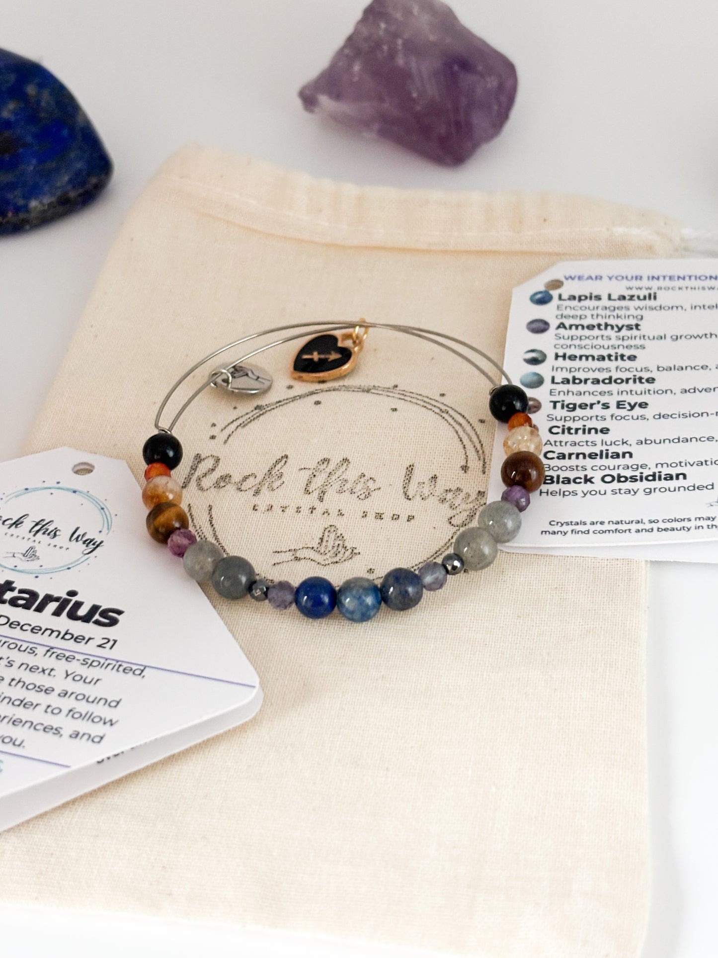 Sagittarius Crystal Charm Bracelet with a black charm displayed in Rock This Way Crystal Shop packaging, ideal for gifting adventurous souls.