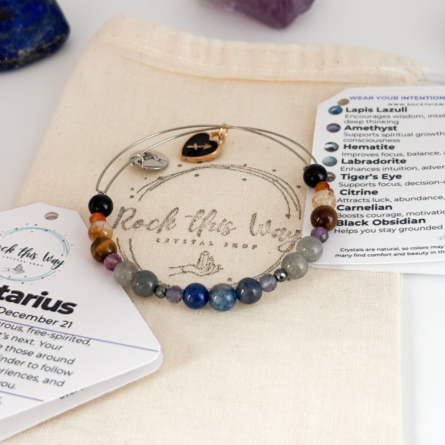 Sagittarius Crystal Charm Bracelet with a black charm displayed in Rock This Way Crystal Shop packaging, ideal for gifting adventurous souls.