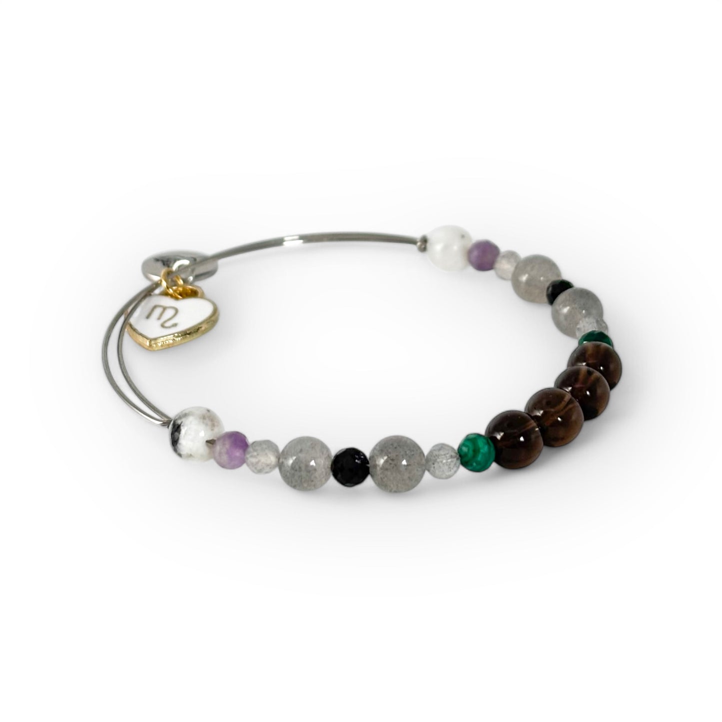 Close-up of Scorpio Crystal Charm Bracelet with a white charm, showcasing its deep, mysterious gemstone hues.