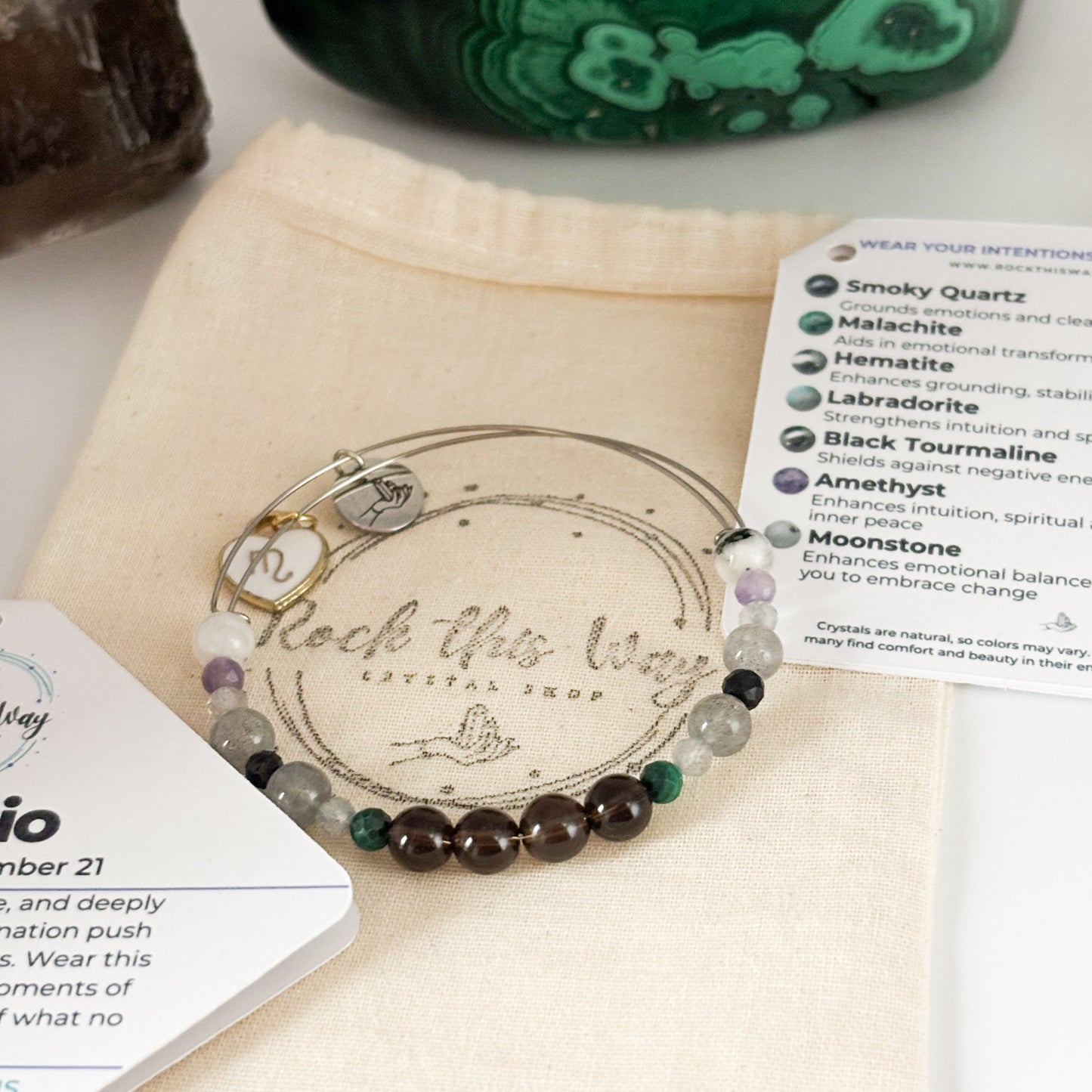 Scorpio Crystal Charm Bracelet with a white charm displayed in Rock This Way Crystal Shop packaging, ready for gifting.