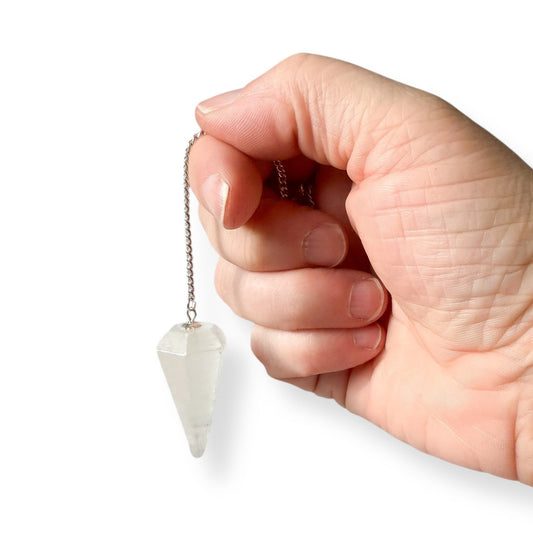 Selenite dowsing pendulum used as a spiritual tool for guidance