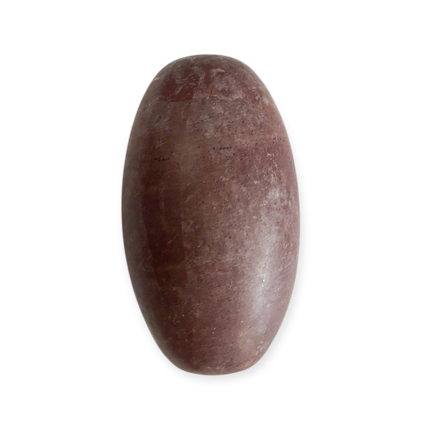 Side angle of the Shiva Lingam stone highlighting natural markings and organic texture