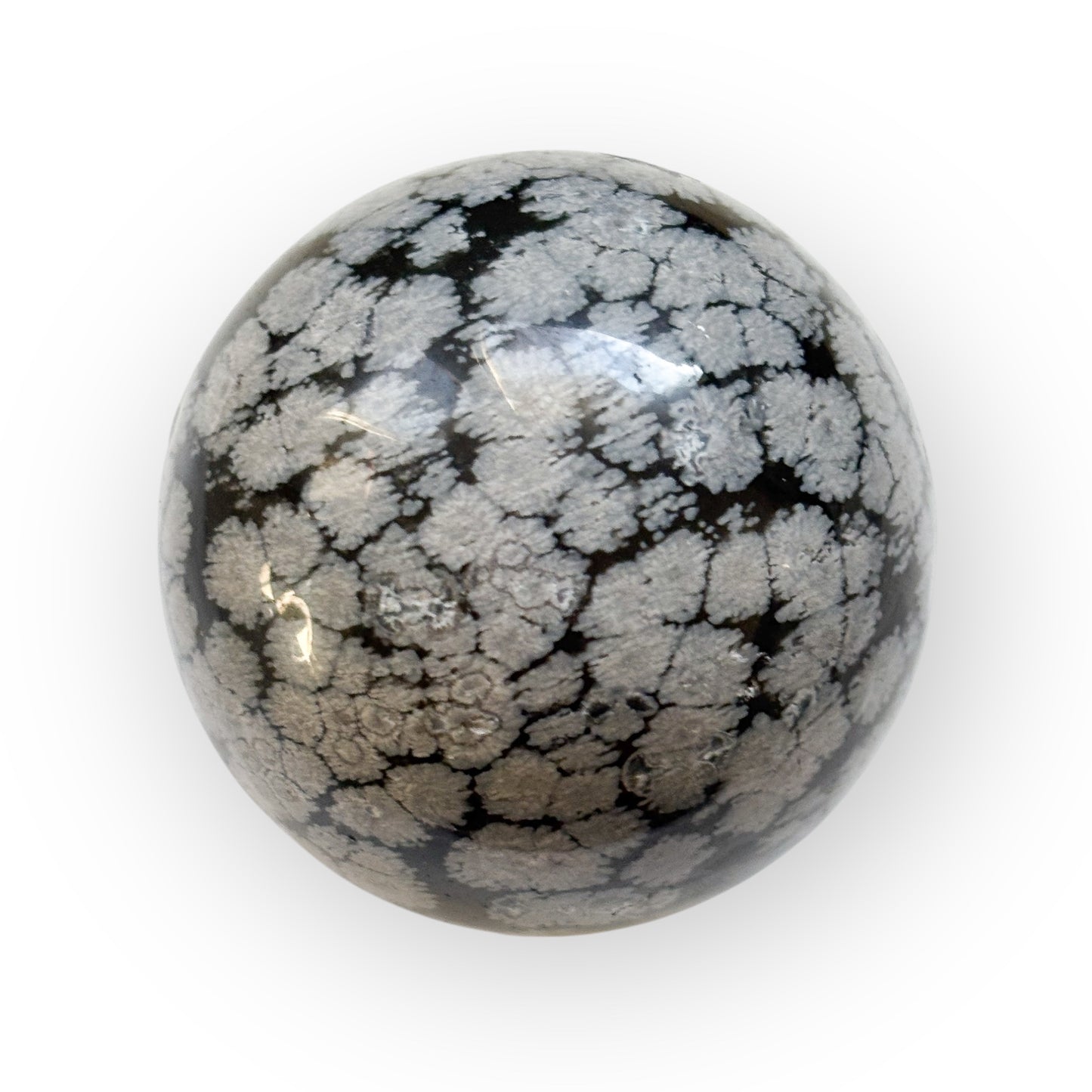 Side view of Snowflake Obsidian Sphere showing natural crystal patterns