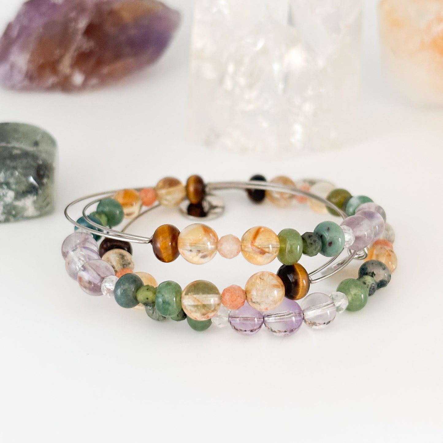Stacked crystal bangles with the Success Bangle as a statement piece
