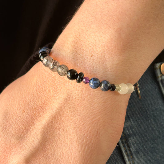 Strength Bracelet styled on wrist with neutral outfit