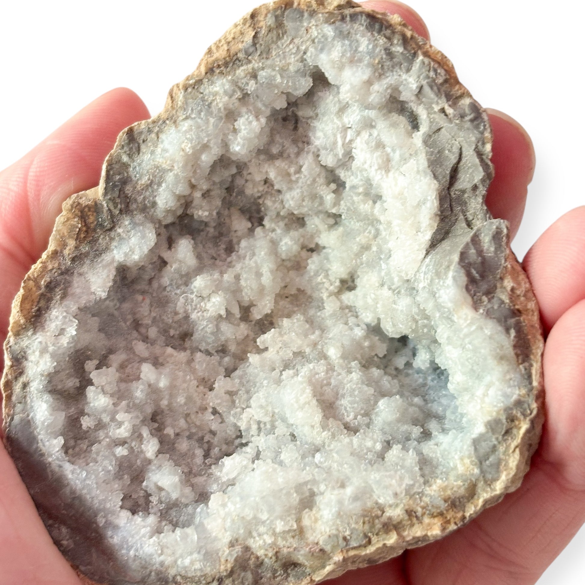 Close-up of sparkling Sugar Quartz crystal cluster inside geode