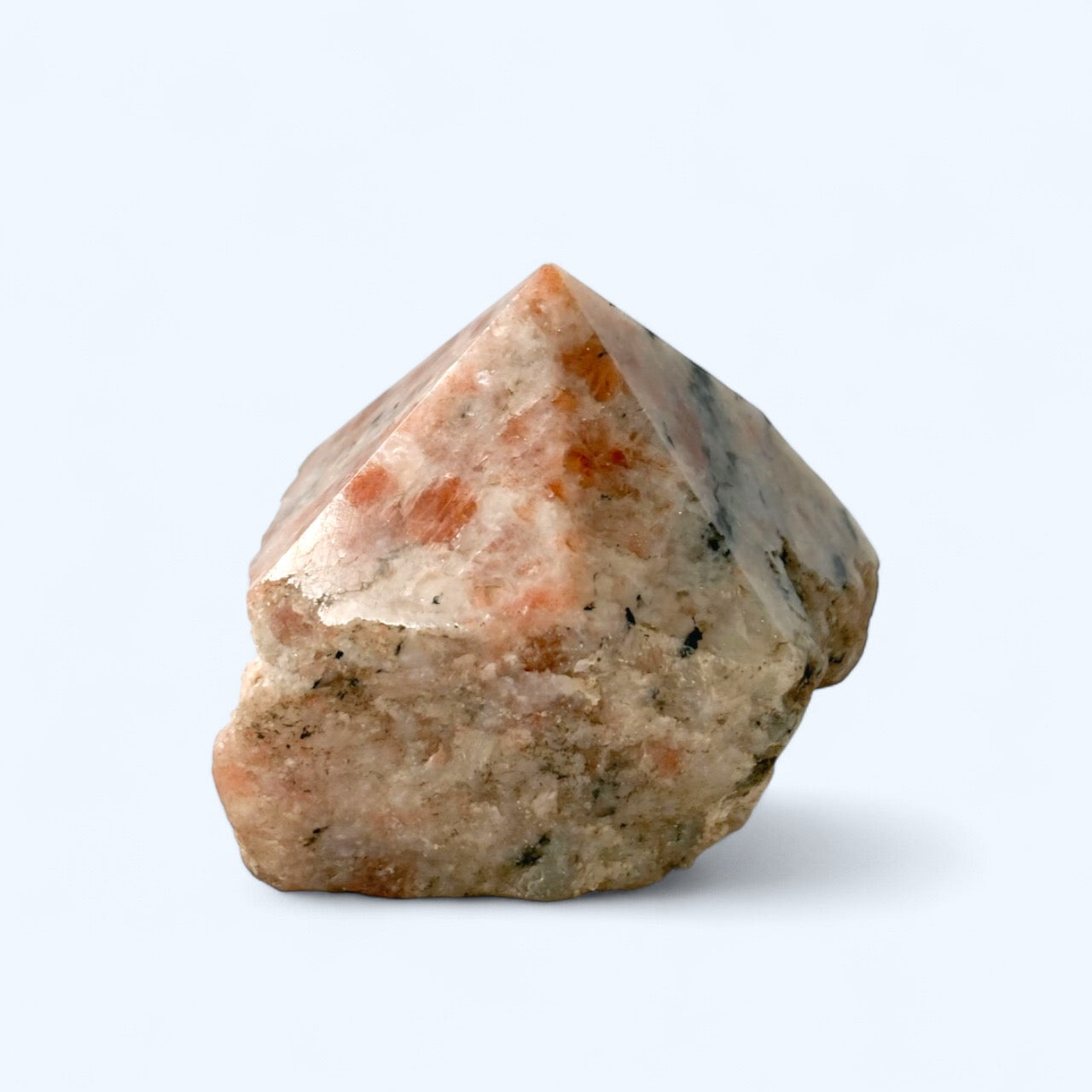 Sunstone crystal point with polished top and raw base in warm peach and orange tones