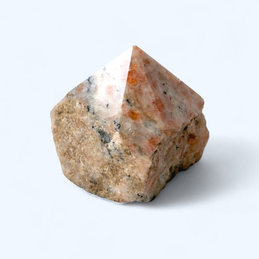 Side angle of Sunstone point showing natural sparkle and gradient color