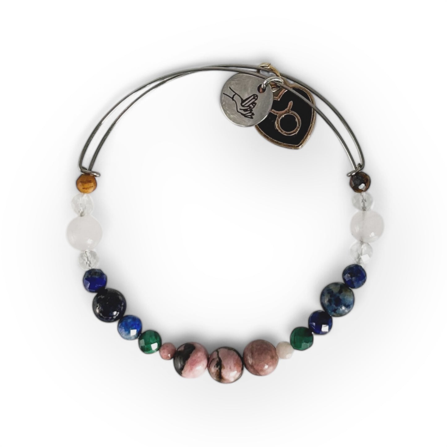 Taurus Crystal Charm Bracelet with a black charm, featuring Rhodonite, Malachite, Lapis Lazuli, Clear Quartz, Rose Quartz, and Tiger’s Eye for grounding and emotional balance.