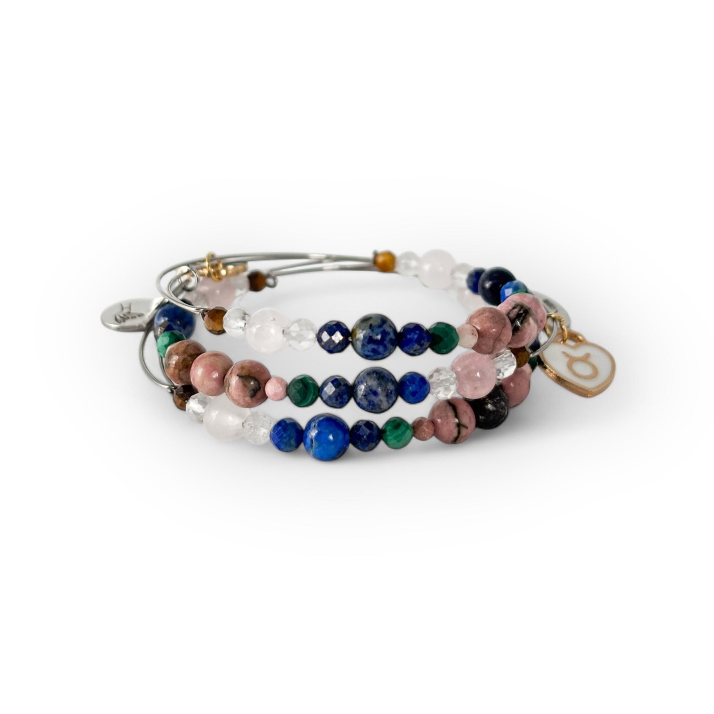 Taurus Crystal Charm Bracelet with a black charm stacked with other bracelets for a steady, confident look.