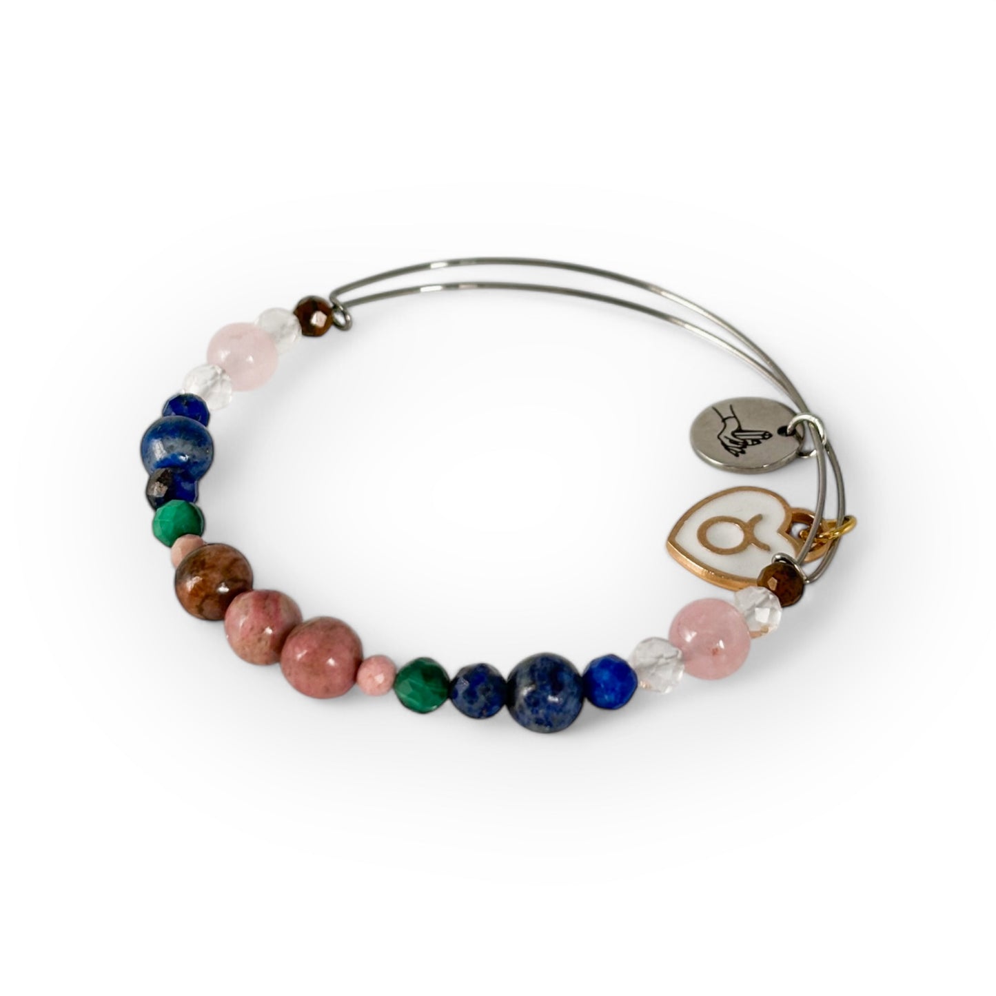 Close-up of Taurus Crystal Charm Bracelet with a white charm, showcasing its earthy and heart-centered crystal mix.