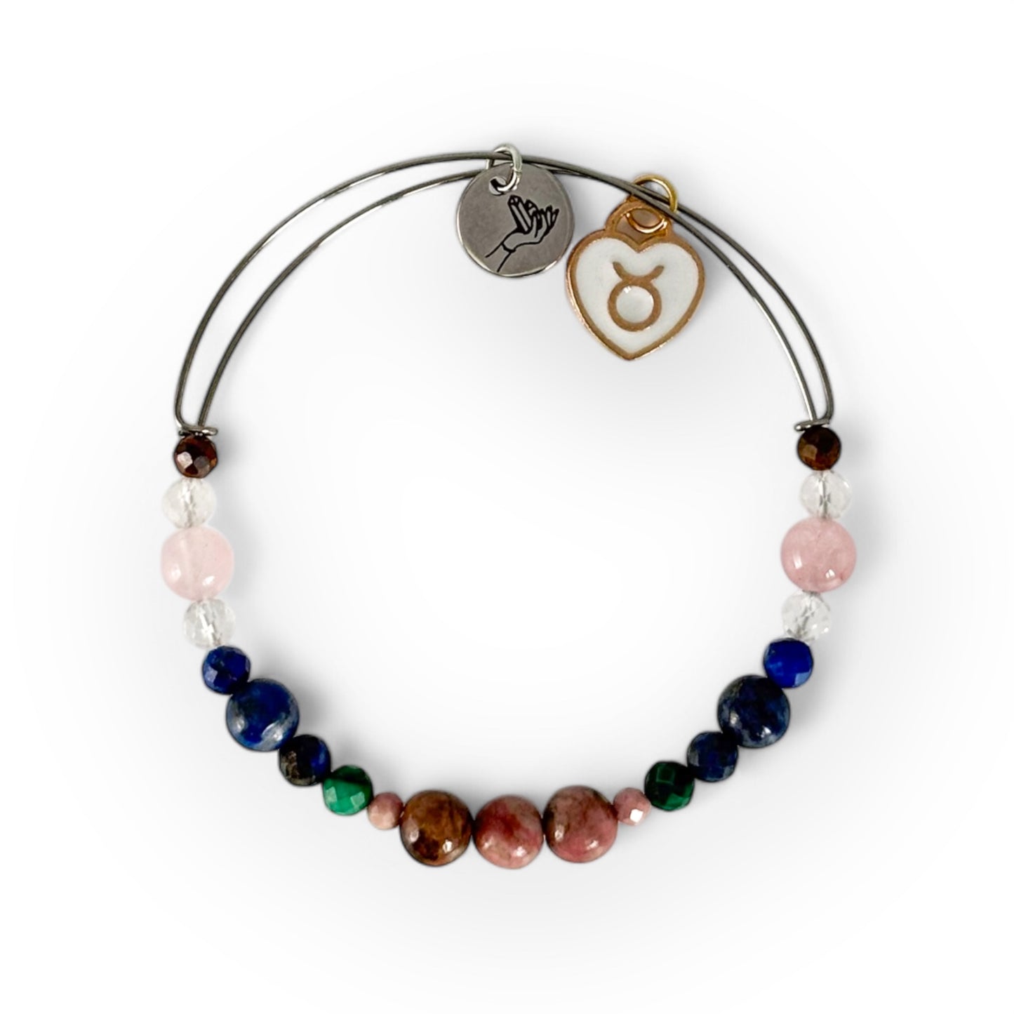 Taurus Crystal Charm Bracelet with a white charm, handcrafted with Rhodonite, Malachite, Lapis Lazuli, Clear Quartz, Rose Quartz, and Tiger’s Eye for strength and balance.