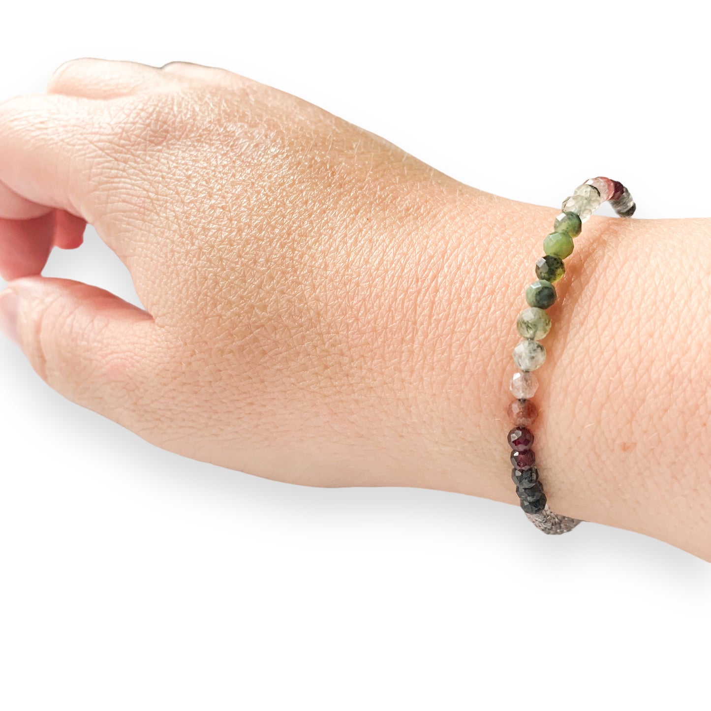 Natural stone details of Tenacious Wrap Bracelet featuring Prehnite, Tourmaline in Quartz, and Clear Quartz.