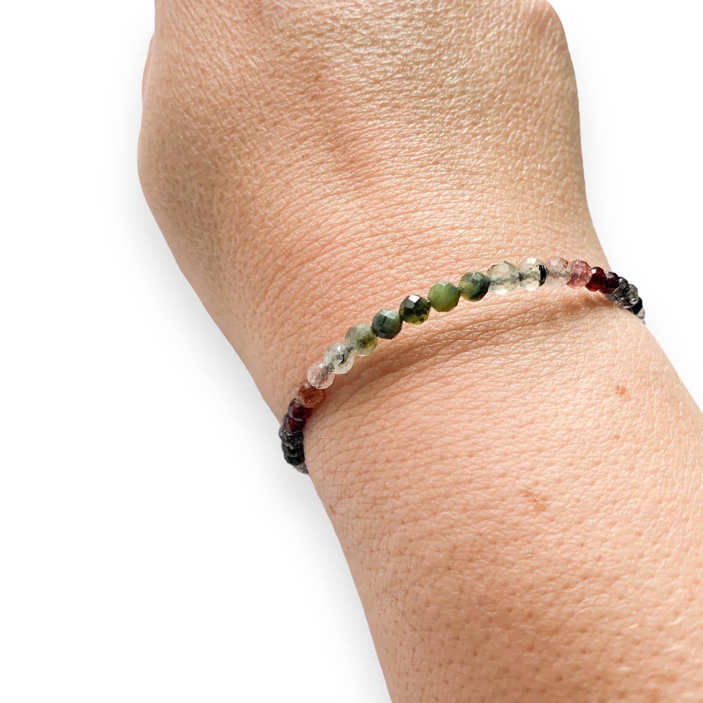 Side angle view of Tenacious Wrap Bracelet with 4mm faceted natural stone beads.