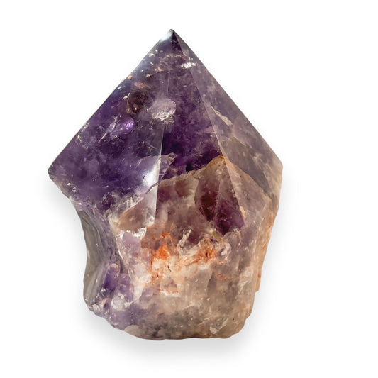 Amethyst side view of crystal point with polished top and raw base in purple and orange tones