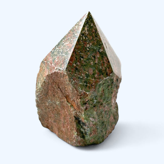 Angled view of Unakite top polished point showing texture and natural color
