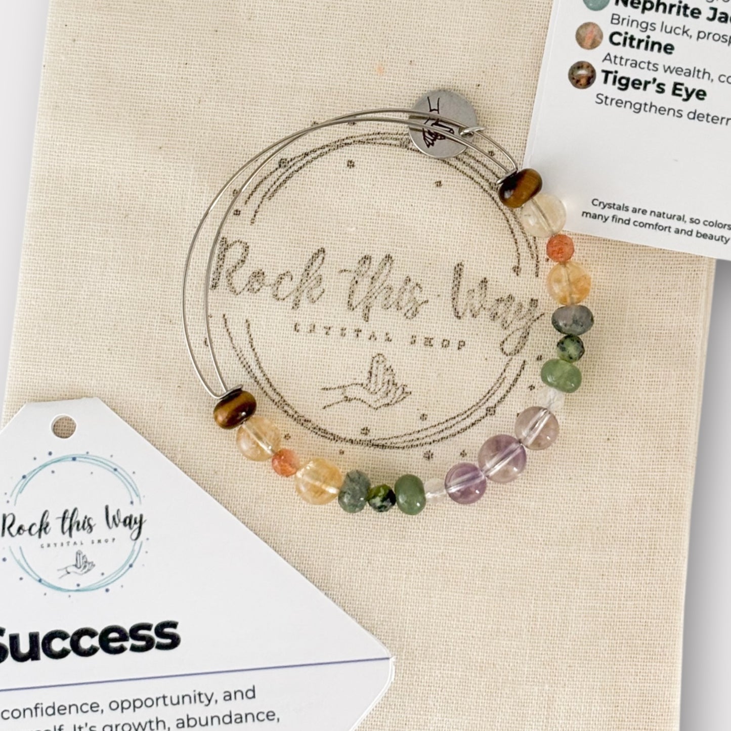 Unique natural crystals of the Success Bracelet, including Moss Agate, Nephrite Jade, and Clear Quartz