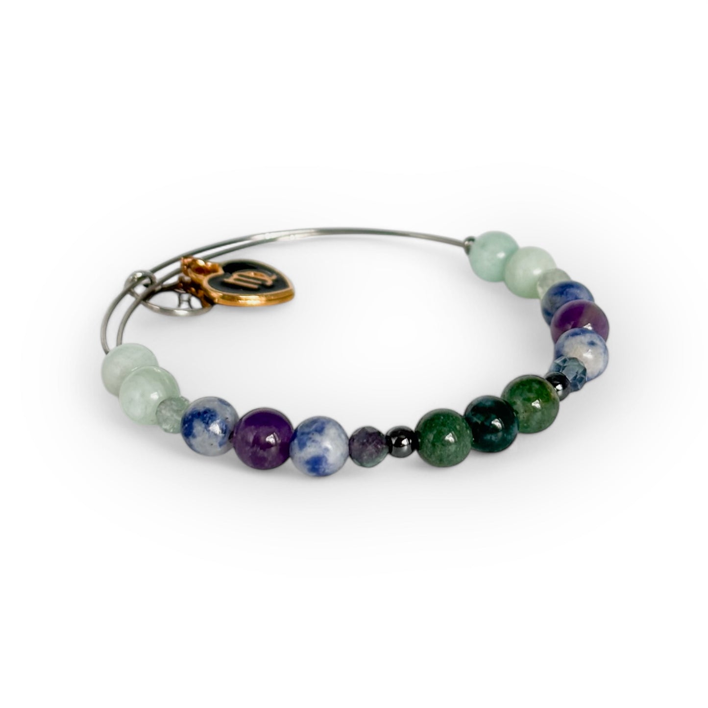 Close-up of Virgo Crystal Charm Bracelet with a black charm, highlighting its smooth, grounding crystal beads.