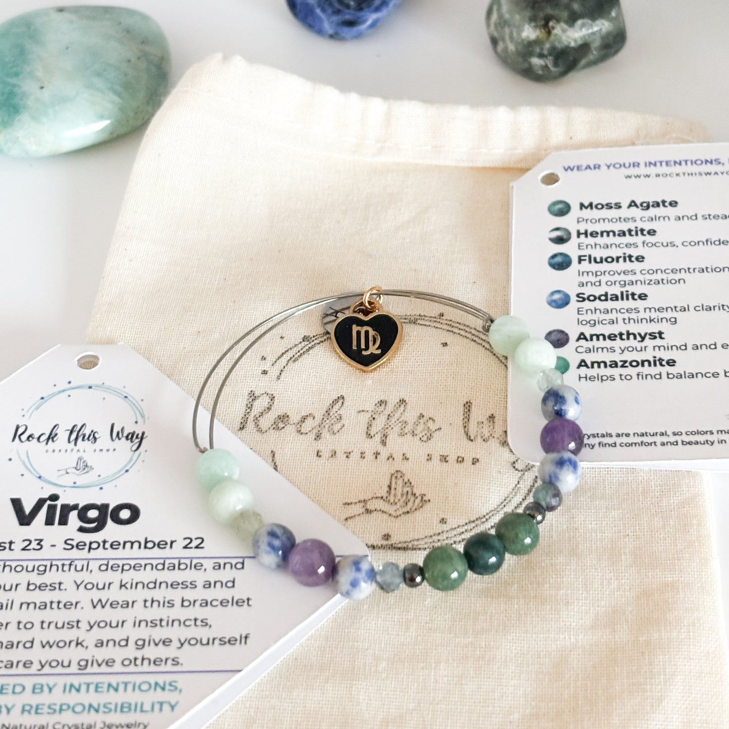 Virgo Crystal Charm Bracelet with a black charm displayed in Rock This Way Crystal Shop packaging, ideal for gifting.