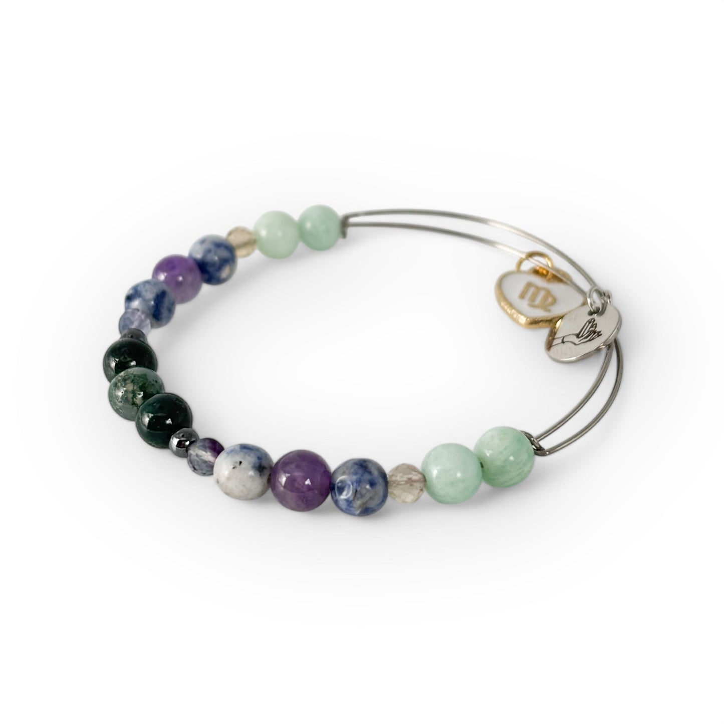 Close-up of Virgo Crystal Charm Bracelet with a white charm, showcasing its cool-toned gemstones for clarity and organization.