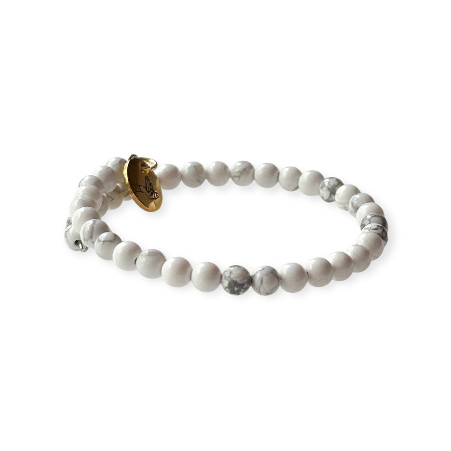 Close-up of 4mm round White Howlite beads with gray marbling