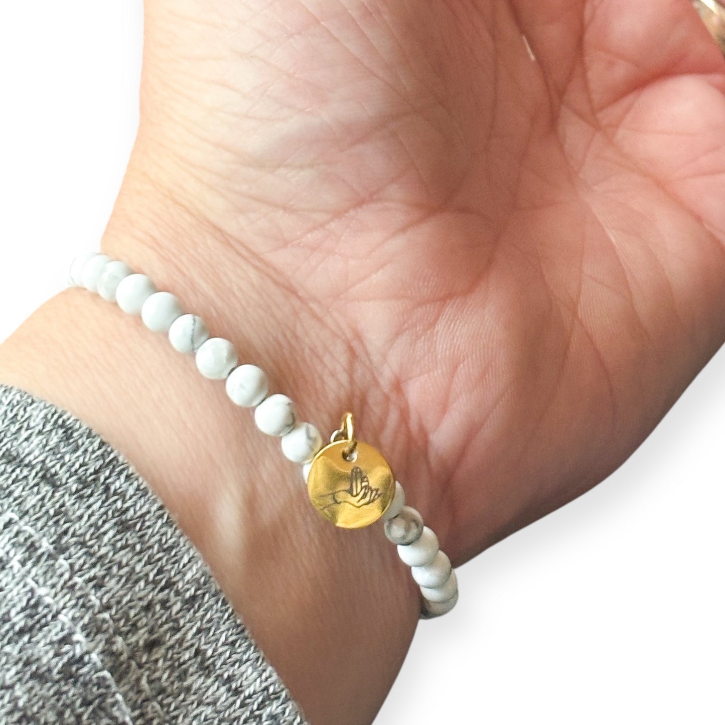 Side angle of White Howlite wrap bracelet, showing bead texture and band
