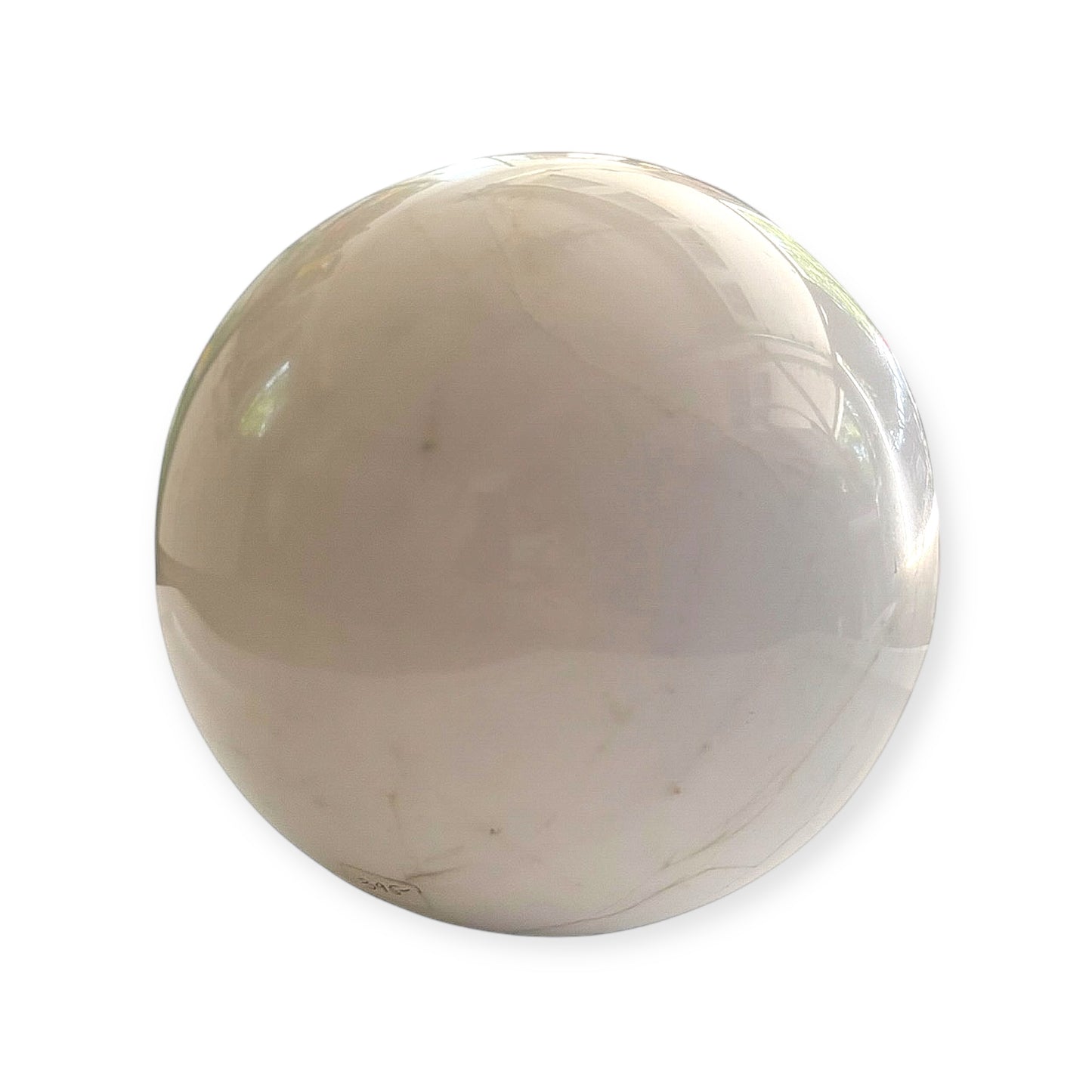 Close-up of polished white marble sphere with subtle stone lines