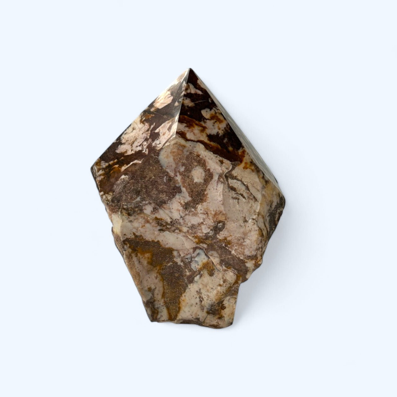 Zebra Jasper tower displayed on shelf as grounding crystal décor