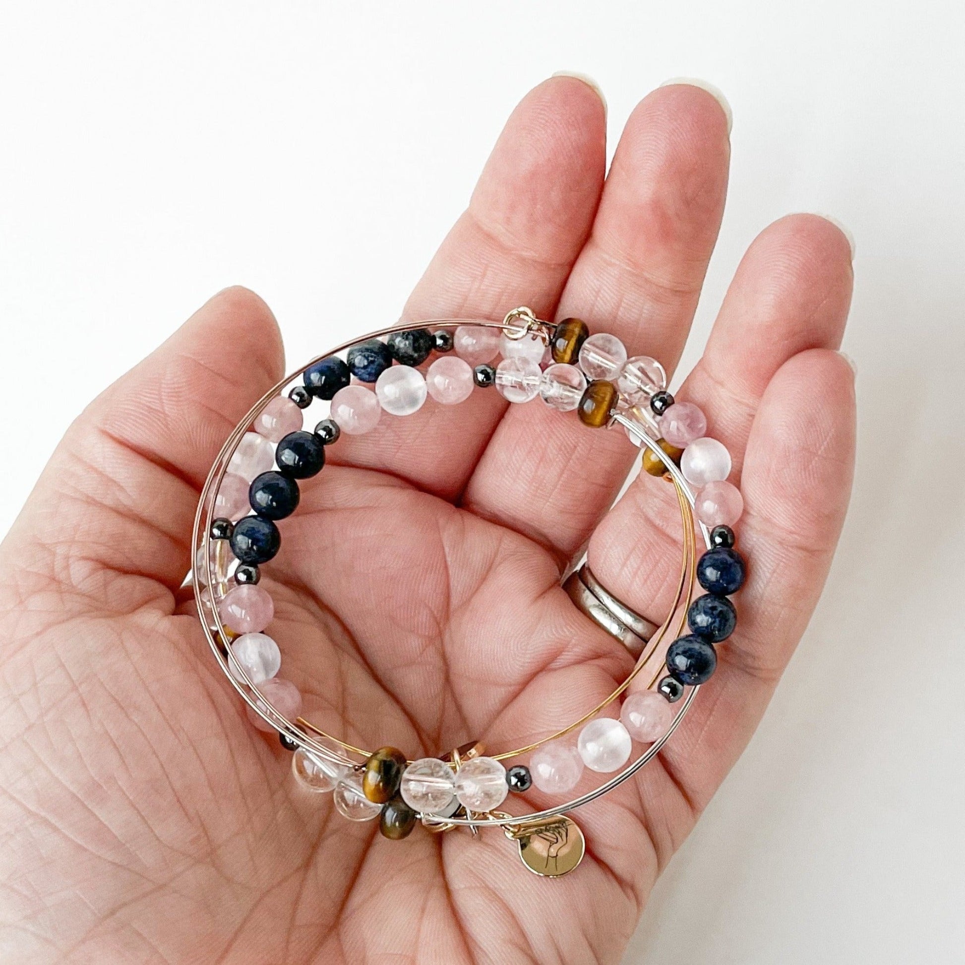 Person holding the Taurus Bracelet, representing Taurus energy.