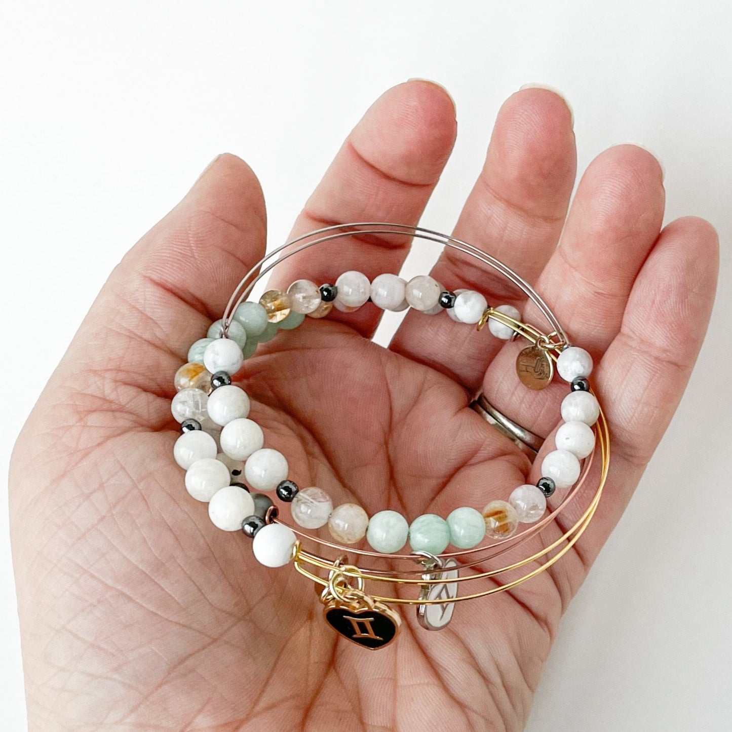 Person holding the Gemini Bracelet, representing Gemini energy.
