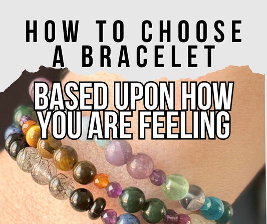 Stack of colorful crystal bracelets on wrist – how to choose a bracelet based on how you’re feeling
